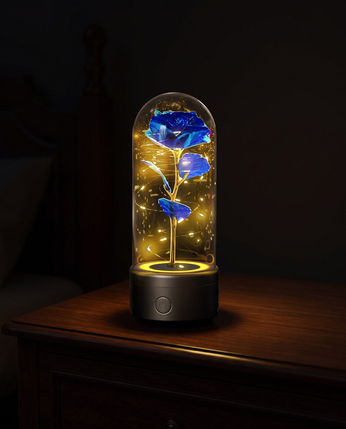 Rose lamp with a speaker base glowing gold on a dresser in a dark room