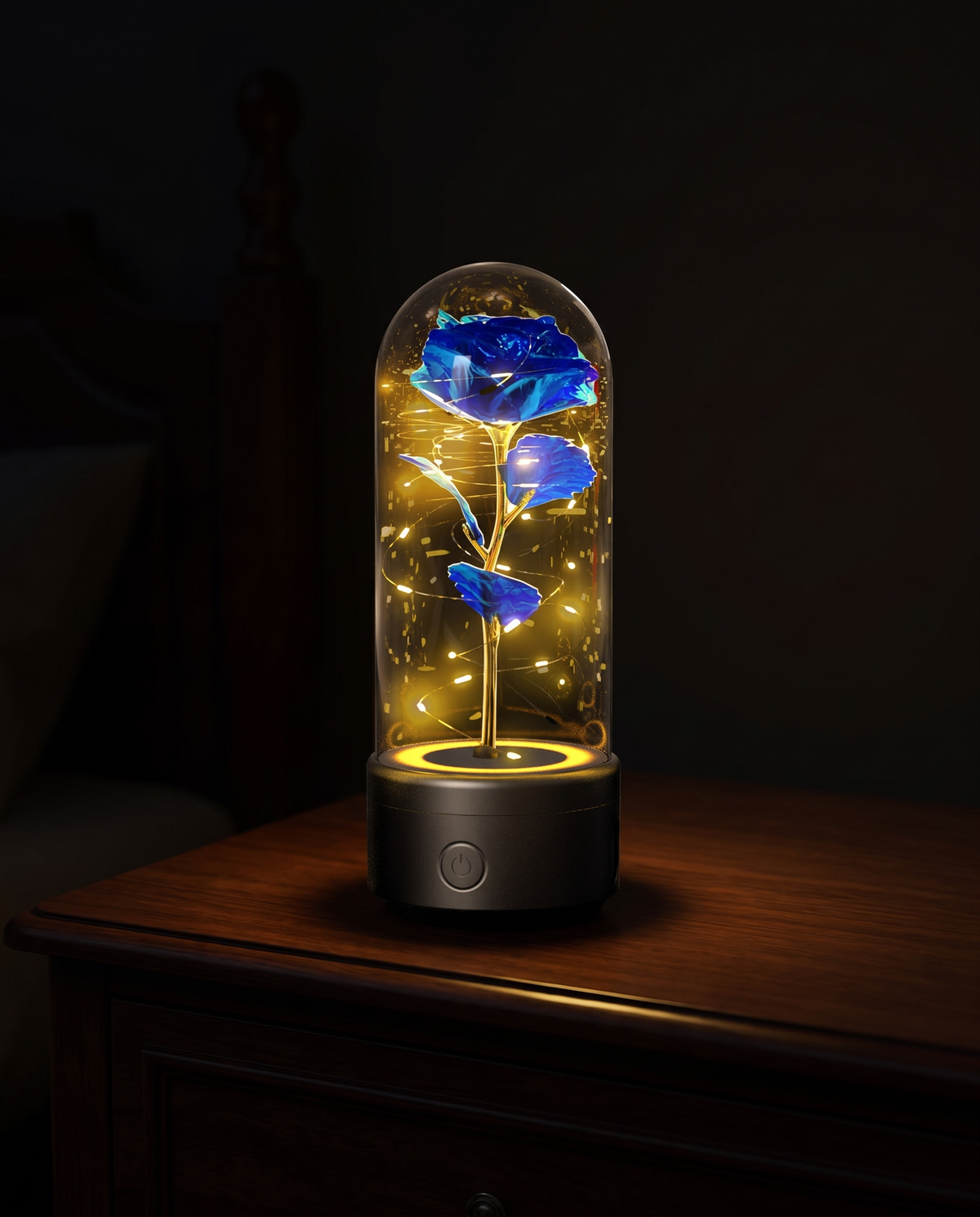 Illuminated rose lamp with a speaker base glowing gold in a dark room